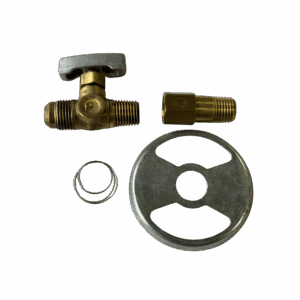 Disassembled brass valve with a handle and washer on a green surface.