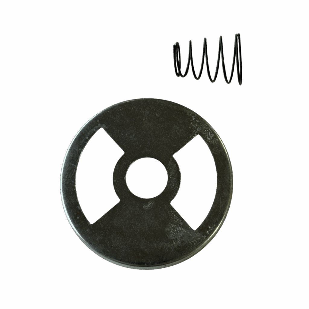 A metal circular plate with three cutouts and a small coil spring beside it.