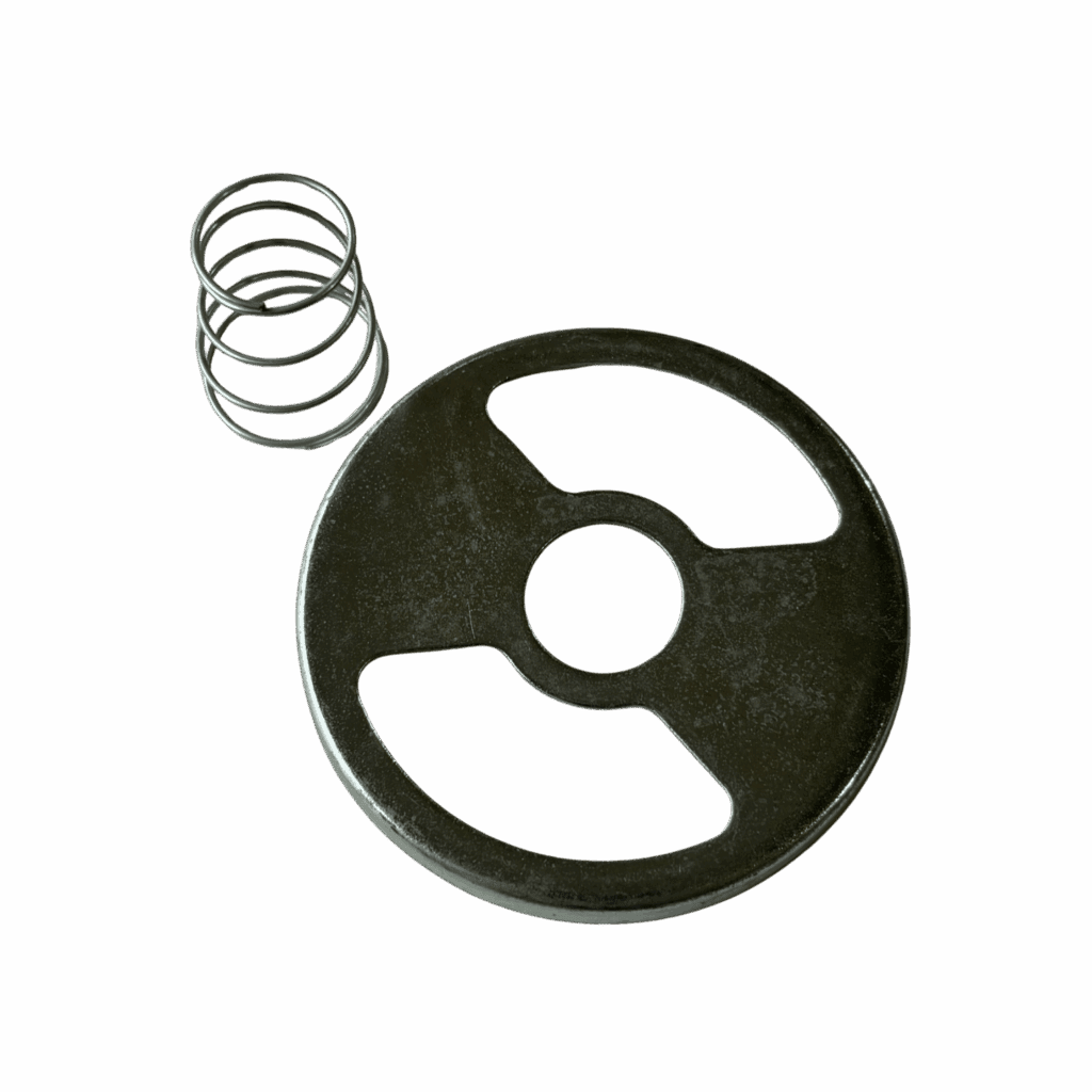 A metal spring and a round metal disc with holes.