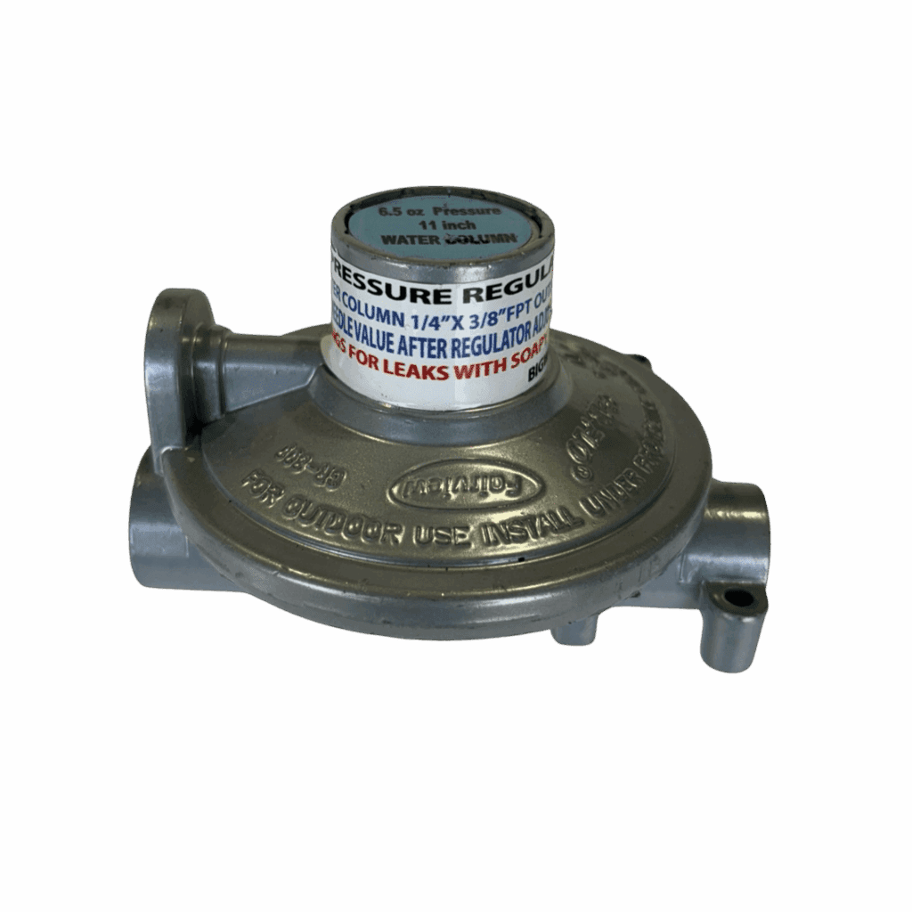 A metal gas regulator with warning labels and connection ports.