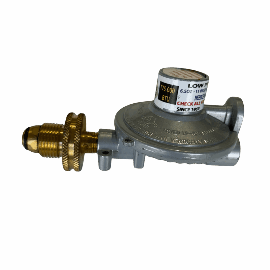 A metallic gas regulator with brass fittings on a gray background.
