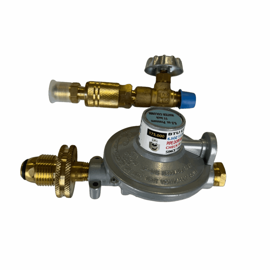 A brass gas pressure regulator with adjustment knob and gauges.