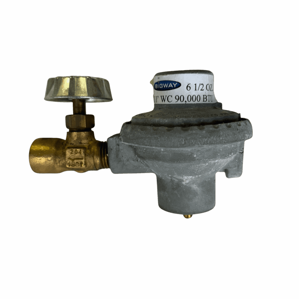 A brass valve connected to a grey industrial gas regulator.