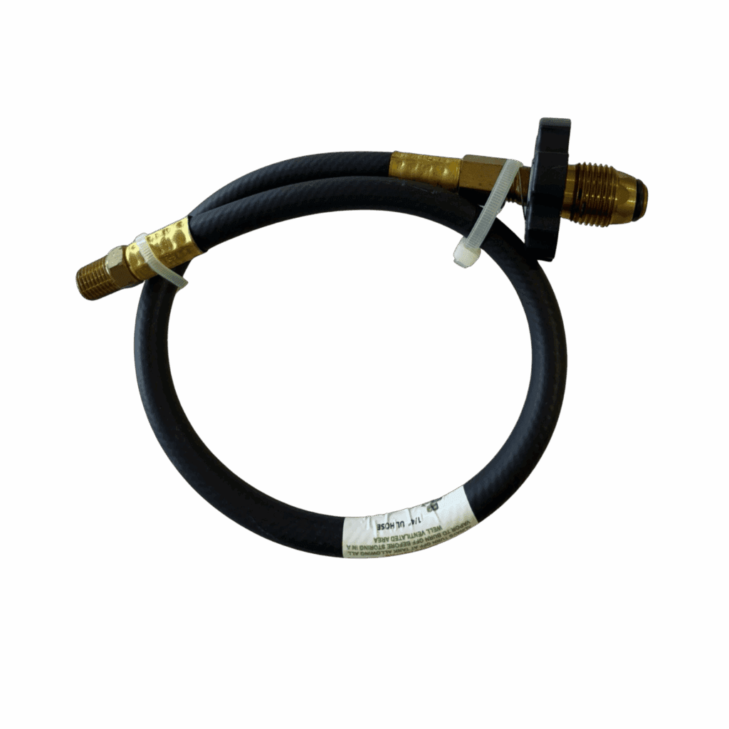 Coiled black hose with brass fittings on a gray background.