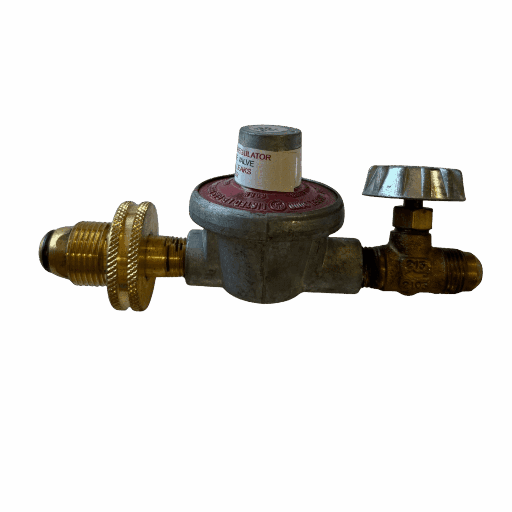 A brass gas pressure regulator with valves and fittings.