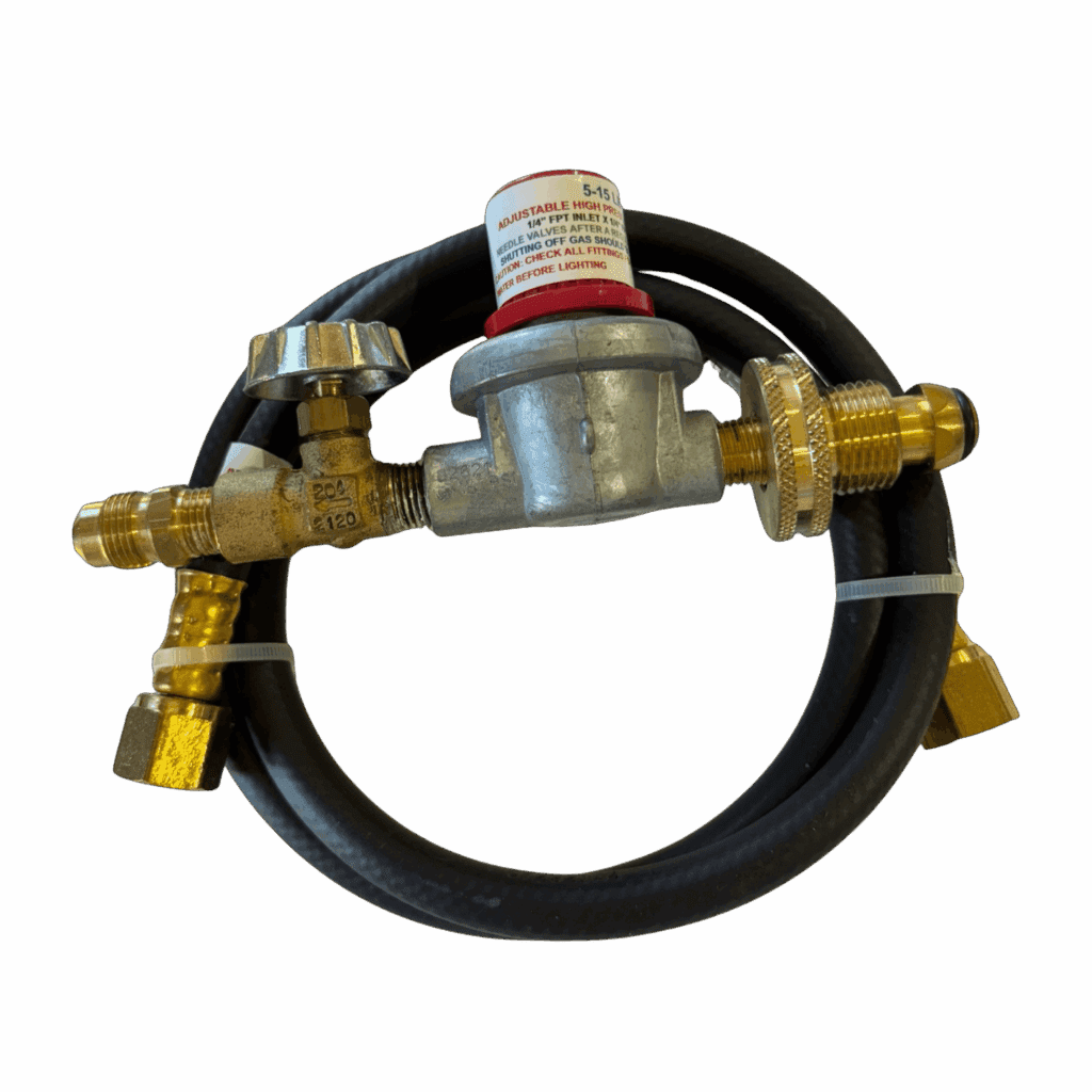 Fuel regulator with attached hose and brass fittings.