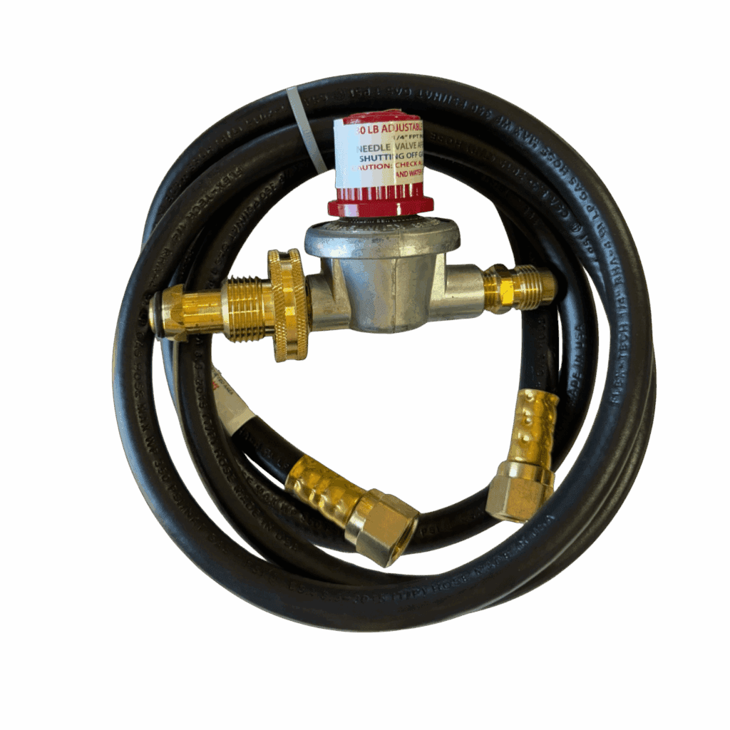 Gas regulator with attached hose and brass fittings.