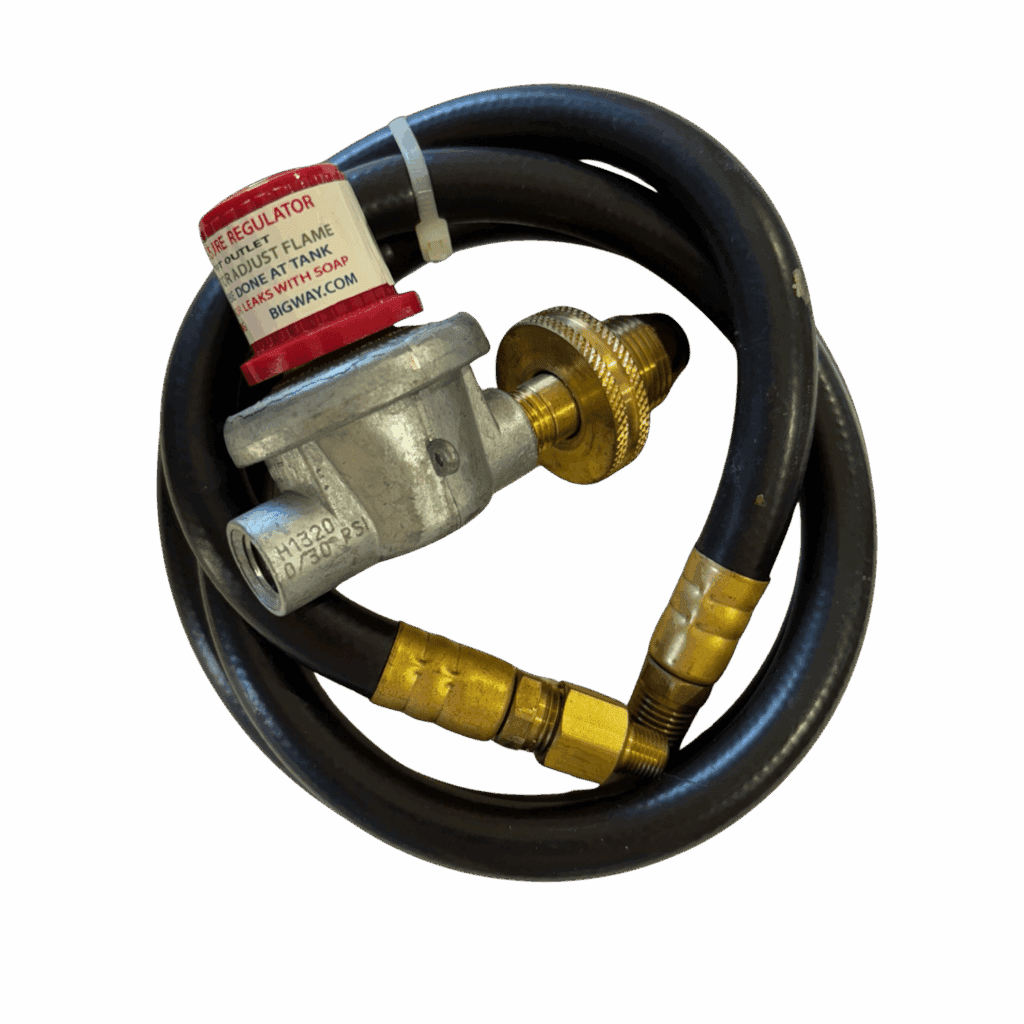 A coiled black gas hose with brass fittings and a red safety tag.