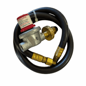 A coiled black gas hose with brass fittings and a red safety tag.