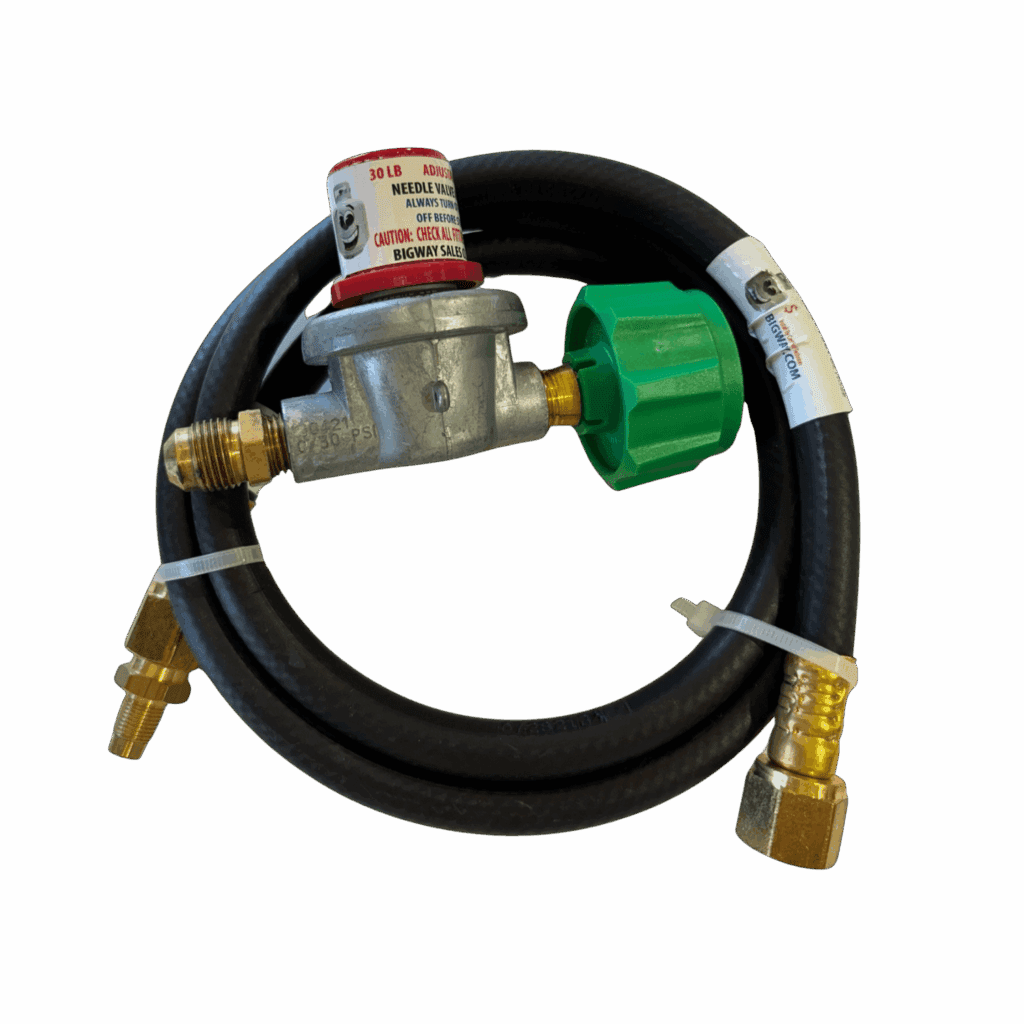 Gas regulator with hose and brass fittings.