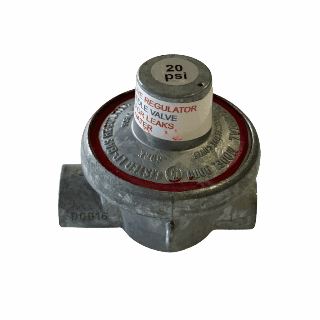 A metallic gas regulator with a pressure gauge on top.