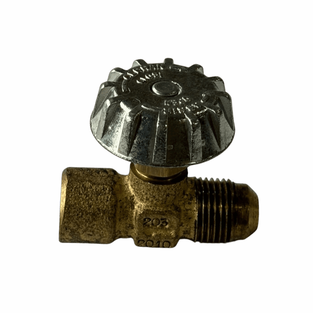 Old brass valve with a black metal handle against a dark background.